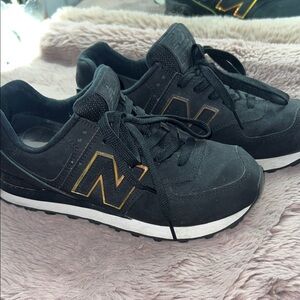Black New balance 574 with Gold Accents